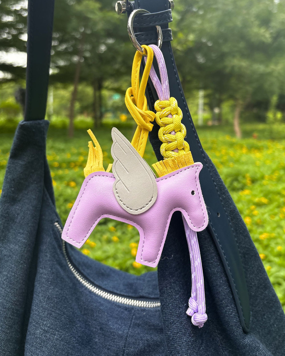 lumi crochet handmade bag charm clipped to tote