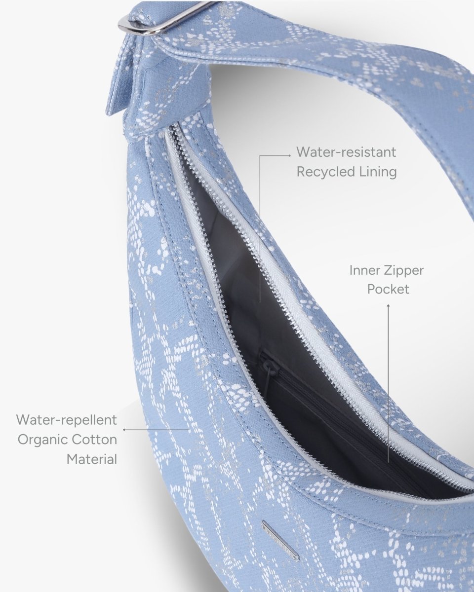 Siren moon bag with curved design worn as a shoulder bag