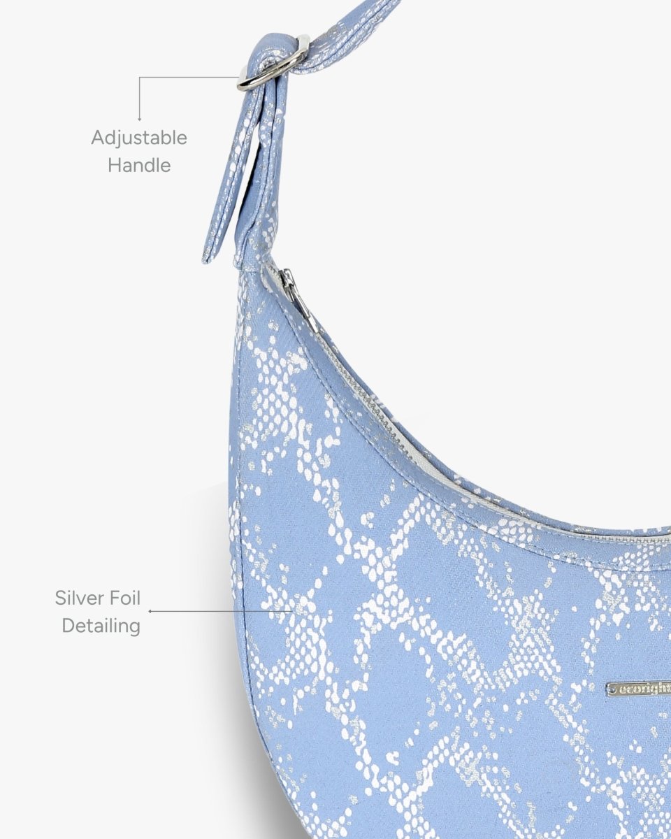 Siren moon bag with curved design worn as a shoulder bag